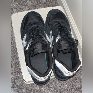 New Balance Black Sneakers with Silver Accents